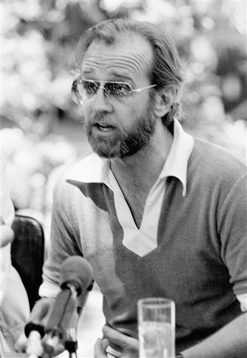 Comedian George Carlin gestures during a news conference in Los Angeles Monday, July 3, 1978. Carlin said the U.S. Supreme Court "just took another little part out of the First Amendment" when it ruled that the Federal Communications Commission may restrict the broadcast of indecent language. One of Carlin's recordings discusses the use of "dirty words" in our society, was considered in the case. (AP Photo/Robbins. Reprinted with permission from The Associated Press.)