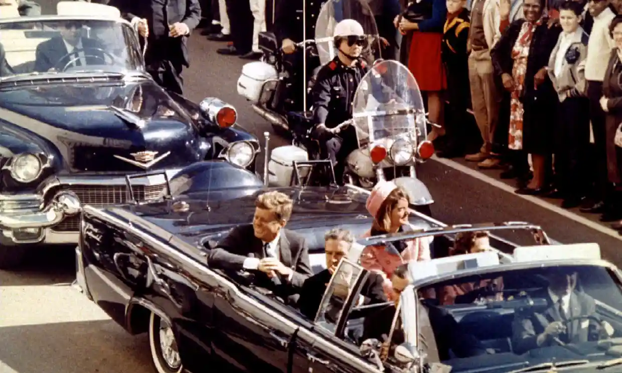 President Kennedy and the first lady ride through Dallas moments before the president was shot by Lee Harvey Oswald, 22 November, 1963. Photograph: Reuters File Photo/Reuters