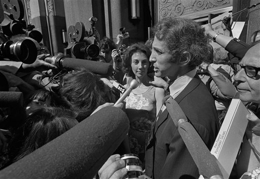 r. Daniel Ellsberg, source of published reports based on Pentagon Papers, places his hand on his wife's shoulder as he talks to newsmen at the Boston federal building on June 28, 1971. Ellsberg, charged in federal warrants with unauthorized possession of top secret documents and failure to return them, arrived to surrender himself to the U.S. Attorney. Ellsberg had passed the documents to reporters at the New York Times, resulting in the case New York Times v. United States (1971). The Court decided 6-3 to allow the Times to publish the papers. (AP Photo, used with permission from the Associated Press)