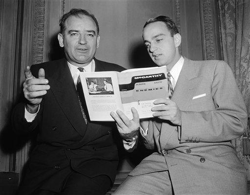The Supreme Court developed and explained the chilling effect doctrine in several opinions issued during the McCarthy era involving laws aimed at suspected communists and subversives. Here, Sen. Joseph R. McCarthy (left) and Roy Cohn, his chief counsel, look over a recently published book, "McCarthy and His Enemies," in New York on April 2, 1954. (AP Photo/Marty Lederhandler, reprinted with permission of The Associated Press.)