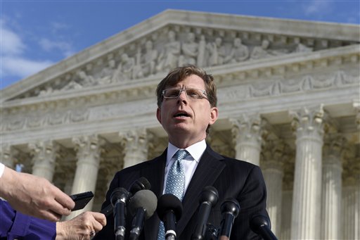 In this Dec. 1, 2014 photo, John P. Elwood, attorney for Anthony D. Elonis, who claimed he was just kidding when he posted a series of graphically violent rap lyrics on Facebook about killing his estranged wife, shooting up a kindergarten class and attacking an FBI agent, speaks to reporters outside the Supreme Court in Washington. The Supreme Court on Monday threw out the conviction of a Pennsylvania man convicted of making threats on Facebook, but dodged the free speech issues that had made the case intriguing to First Amendment advocates. Chief Justice John Roberts, writing for seven justices, said it was not enough for prosecutors to show that the comments of Anthony Elonis would make a reasonable person feel threatened. But the court did not specify to lower courts exactly what the standard of proof for true threats should be. (AP Photo/Susan Walsh, used with permission from the Associated Press)