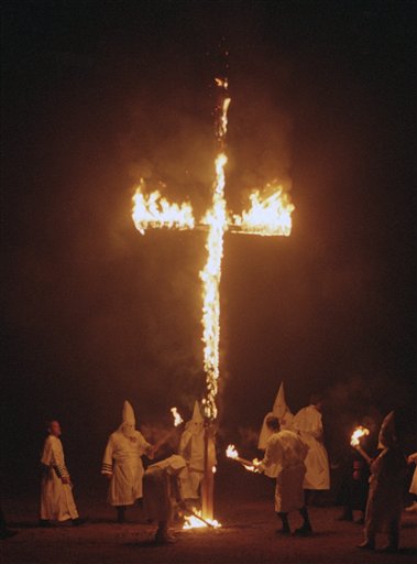 The Supreme Court’s most comprehensive description of true threats on record is found in Virginia v. Black (2003), which ruled that Virginia’s ban on cross burning with intent to intimidate did not violate the First Amendment. The Supreme Court held that states may criminalize cross burning as long as the state statute clearly puts the burden on prosecutors to prove that the act was intended as a threat and not as a form of symbolic expression. In this photo, members of the Ku Klux Klan circle a burning cross in a field in Oak Grove, Michigan, June 24, 1995 while chanting "white power." (AP Photo/Jeff Kowalsky, used with permission from the Associated Press)