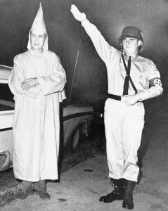 Clarence Brandenburg, 48, an officer in the Ku Klux Klan, left, and Richard Hanna, 21, admitted member of the American Nazi Party, pose for a picture following their arrests, Aug. 8, 1964, Cincinnati, Ohio. Brandenburg was arrested in connection with a KKK meeting in which he made anti-Semitic and anti-black statements and advocated for the possibility of "revengeance." The Supreme Court threw out his conviction and issued a new test: Advocacy could be punished only "where such advocacy is directed to inciting or producing imminent lawless action and is likely to incite or produce such action." (AP Photo)