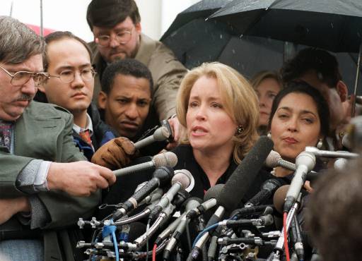 Donna Rice Hughes, of the anti-pornography organization Enough is Enough, meets reporters outside the Supreme Court in Washington Wednesday, March 19, 1997, after the court heard arguments challenging the 1996 Communications Decency Act. The court, taking its first look at free speech on the Internet, was asked to uphold the law that makes it a crime to put indecent words or pictures online where children can find them. (AP Photo/Susan Walsh, reprinted with permission from The Associated Press.)