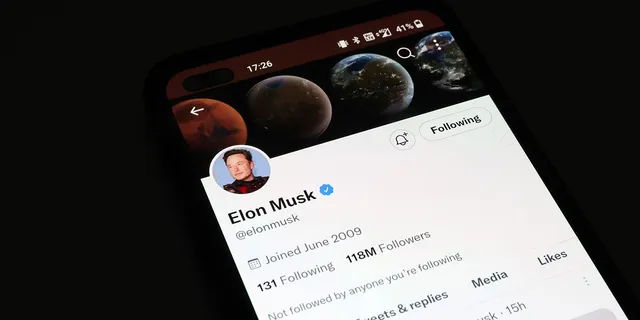 The Twitter account of Elon Musk is displayed on a smartphone on November 21, 2022. (Nathan Stirk/Getty Images)