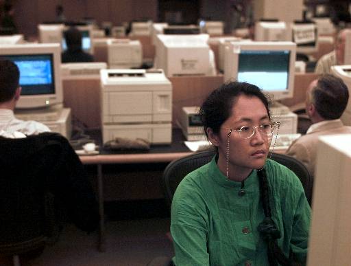 Yi Li uses a computer terminal at the New York Public Library to access the Internet, Wednesday, June 12, 1996. The graduate student from Taiwan supports the federal court decision issued in Philadelphia on Wednesday that bans government censorship of the Internet. Yi Li fears that government control of the Internet could be used by authoritarians to control or confine people. "We can use the (free flow of) information to unite the world," she said. (AP Photo/Mark Lennihan, reprinted with permission from The Associated Press)