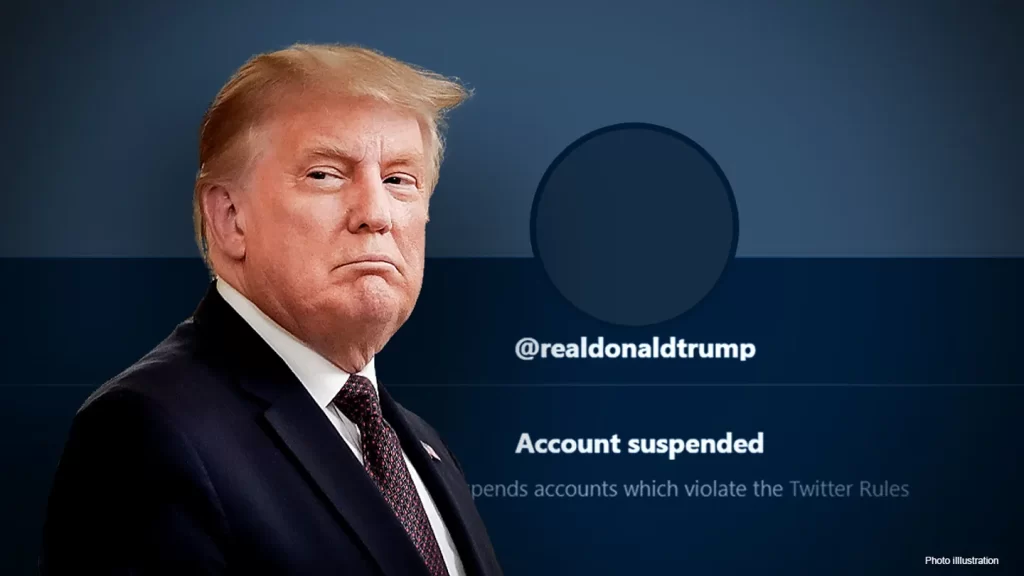 A photo of Donald Trump with his suspended Twitter account. (Getty Images)