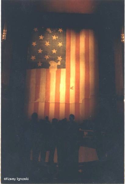 During the 1980's, I visited the National Museum of American History of the Smithsonian Institution(NMAH). At that time, they had on display the inspiration for our national anthem, the Star Spangled Banner. This is the flag that flew over Fort McHenry when the British attacked it on Sept. 13, 1814. Francis Scott Key, a lawyer, had boarded a British ship to try to secure the release of a doctor held prisoner by the British. Key was not able get off the ship before the British fleet started attacking Ft. McHenry. When the bombing stopped, Key looked out and saw this flag flying defiantly over the fort and wrote down his feelings in a poem that would eventually become our national anthem.