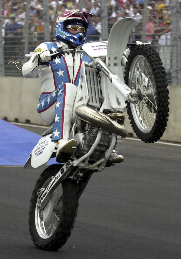 FILE - Motorcycle daredevil Robbie Knievel performs before the start of the Cadillac Grand Prix car race in Washington on July 21, 2002. Knievel, an American stunt performer, died early Friday at a hospice in Reno, Nev., with his daughters at his side, his brother Kelly Knievel said. He was 60. (AP Photo/Kenneth Lambert, File)