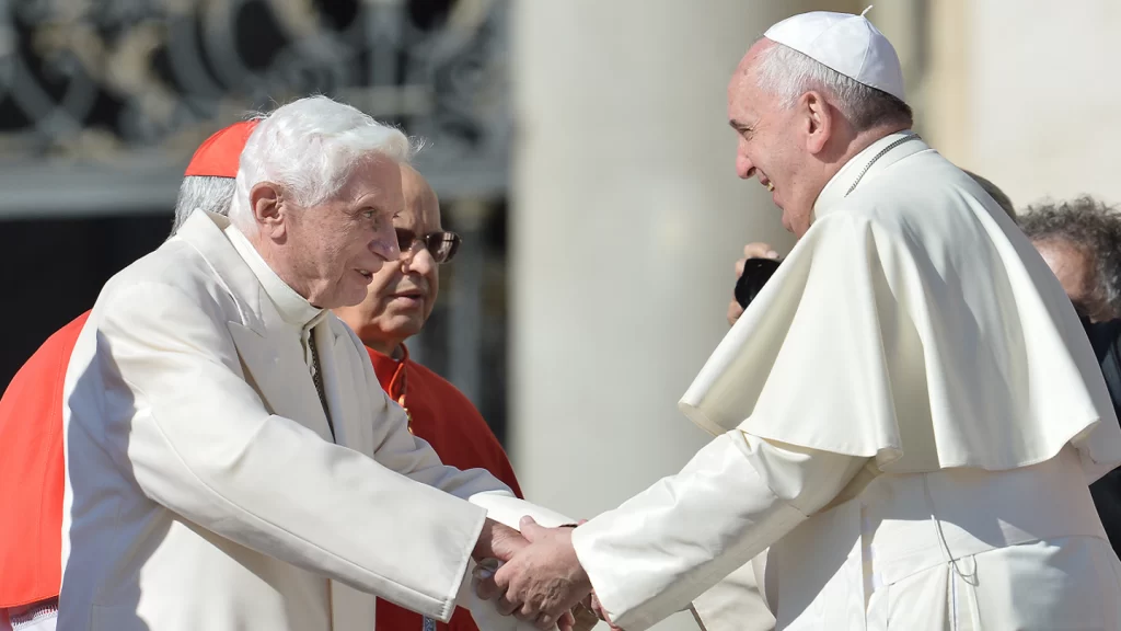 Pope emeritus Benedict XVI speaks with Pope Francis during a papal mass for elderly people at St Peter's square on Sept. 28, 2014 at the Vatican. (TIZIANA FABI/AFP via Getty Images)