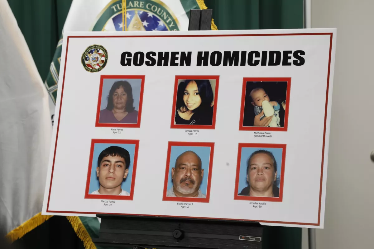 A poster of the victims of the Goshen homicides is displayed at a Tulare County sheriff’s news conference.(Carolyn Cole / Los Angeles Times)