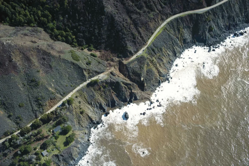 Highway 1 was severed in multiple places in January 2021 by debris flows caused by an atmospheric river that saturated the mountainside. Credit: USGS