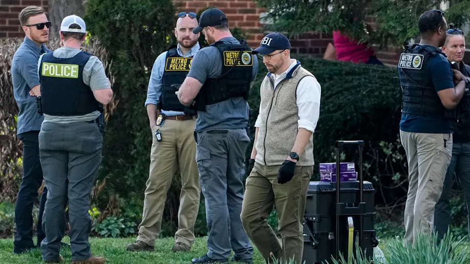 Authorities investigate a home possibly connected to the school shooting in Nashville, Monday, March 27, 2023, in Nashville, Tennessee. (AP Photo/John Bazemore)