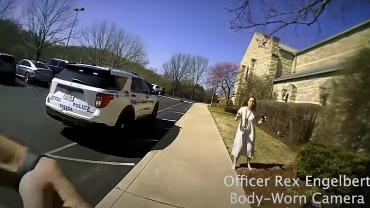 A teacher met the first officer outside the school and immediately started briefing him on the situation inside. (Metropolitan Nashville Police Department)