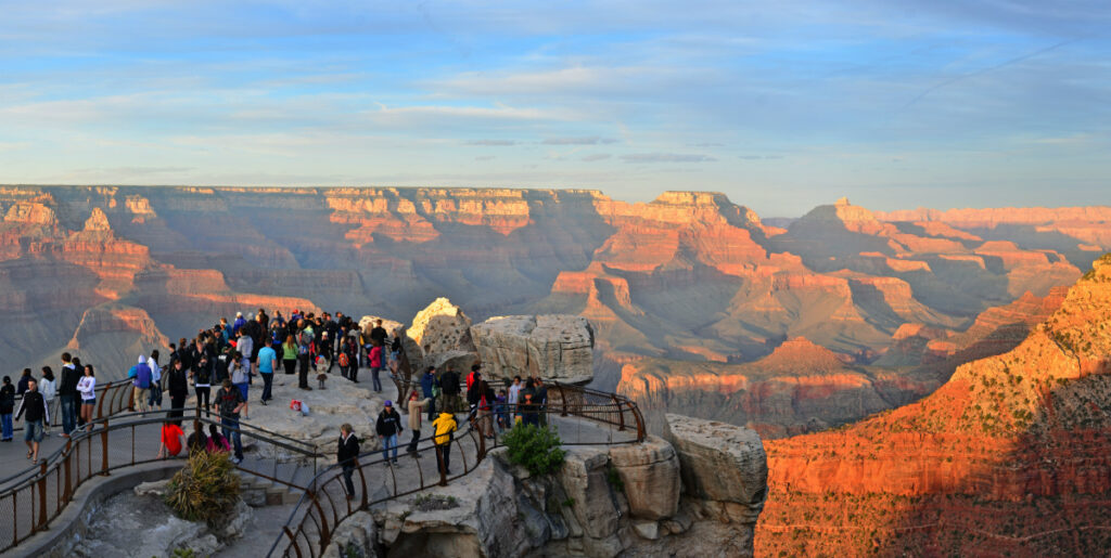 Visitors take in the stunning views of the Grand Canyon at Mather Point. Photo by National Park Service