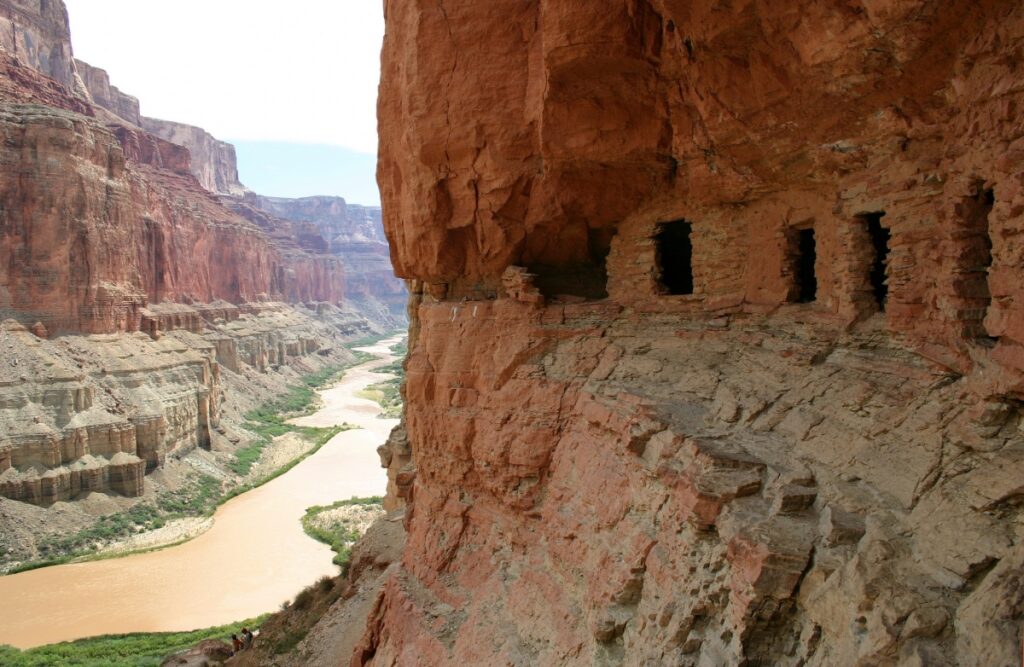 The oldest human artifacts found in the Grand Canyon are nearly 12,000 years old and date to the Paleo-Indian period. There has been continuous use and occupation of the park since that time. Photo of granaries above Nankoweap by National Park Service.
