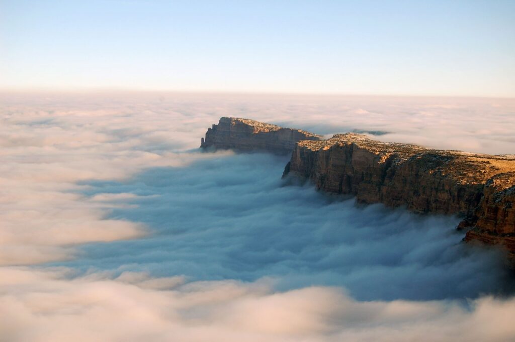 An amazing image of a total cloud inversion in 2013. This rare meteorological event fills the canyon with a sea of clouds when the air near the ground is cooler than the air above it. It's something park rangers wait years to see. Photo by Erin Huggins, National Park Service.