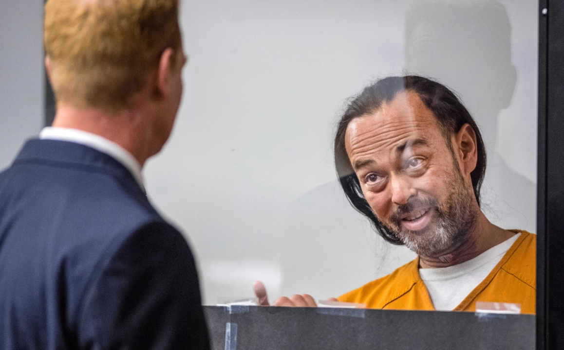 Forrest Clark, the man accused of intentionally setting the massive Holy fire in the Cleveland National Forest, speaks with one of his attorneys in Orange County Superior Court on Aug. 17, 2018. (Photo by Mark Rightmire, Orange County Register/SCNG)