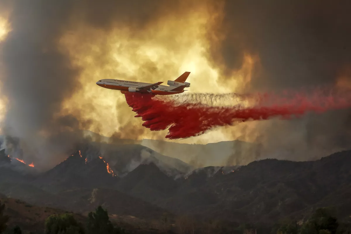 A DC-10 makes a fire retardant drop over Holy fire that burned in Orange and Riverside counties in August 2018.(Irfan Khan / Los Angeles Times)